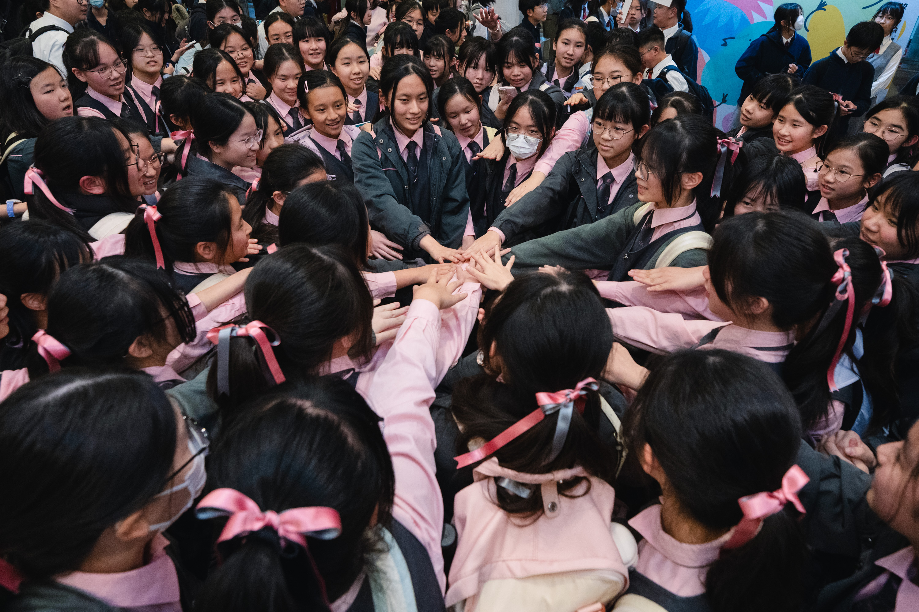 HKICF students bringing their hands together after a festival activity