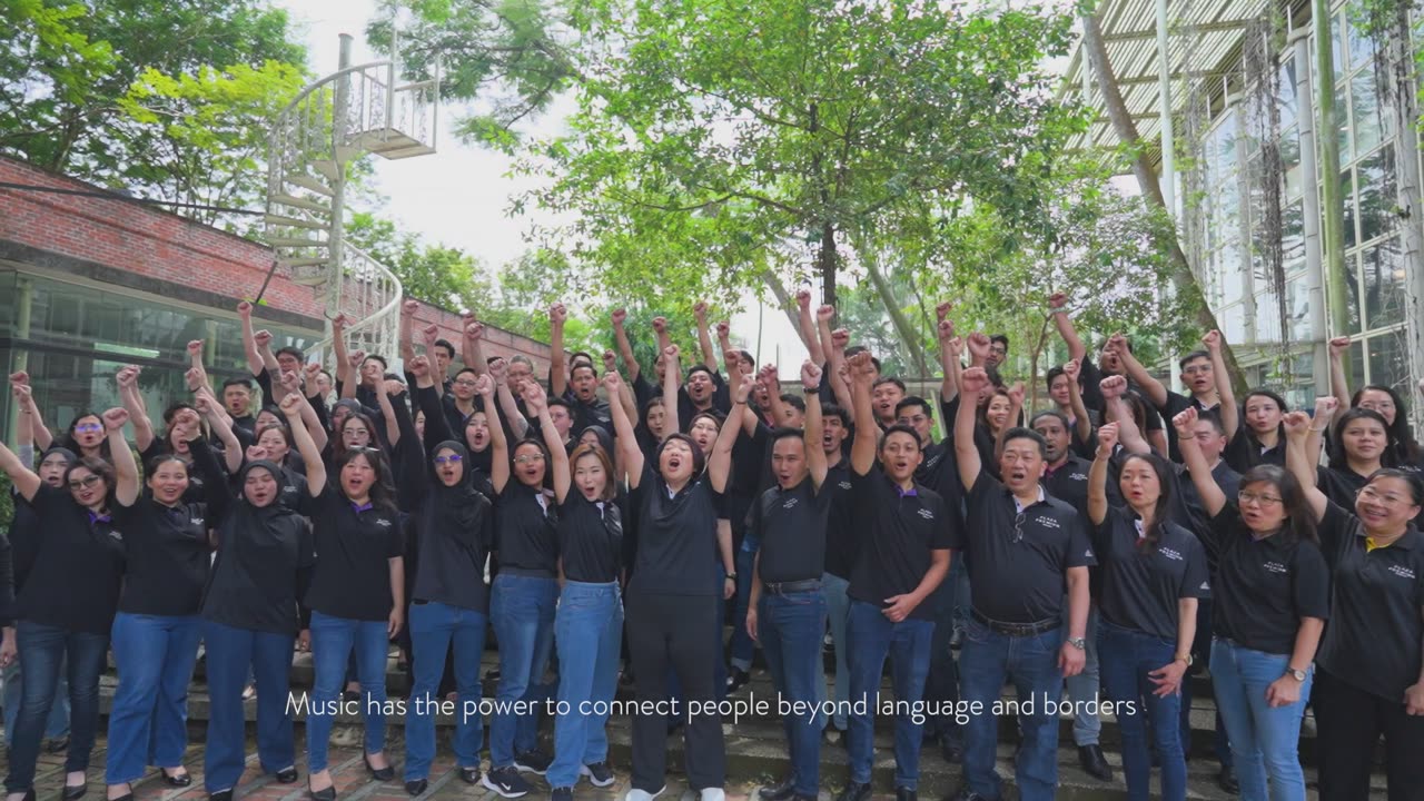 Singers celebrate with raised hands in the MCE 'Malaysia KL Story' film