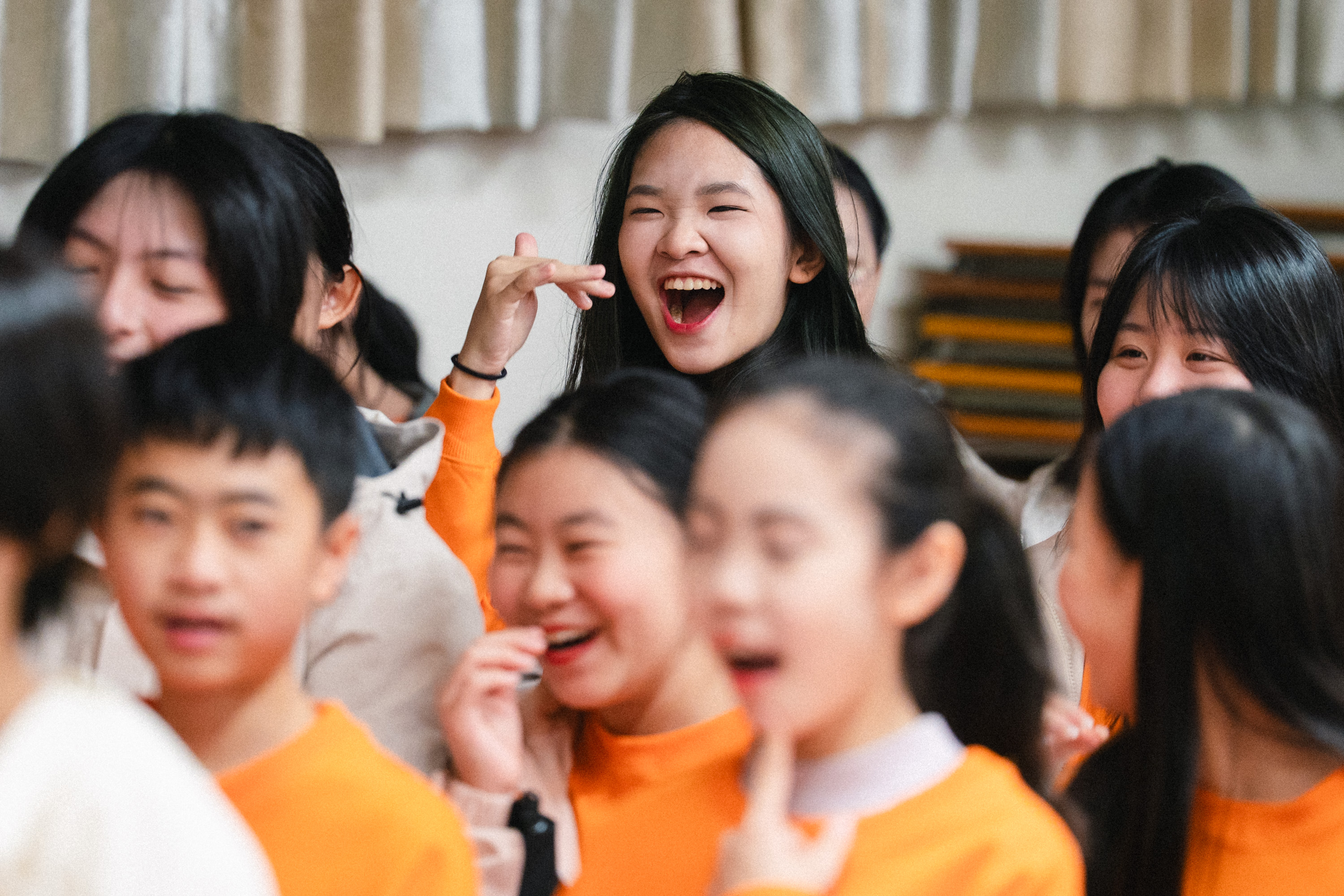Students laughing joyfully at an HKVC school choral celebration